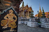 Bangkok Grand Palace, murals of the gallery of the Wat Phra Kaew, the monkey warrior Surakaan from the Ramakien, on the background the Royal Pantheon. 